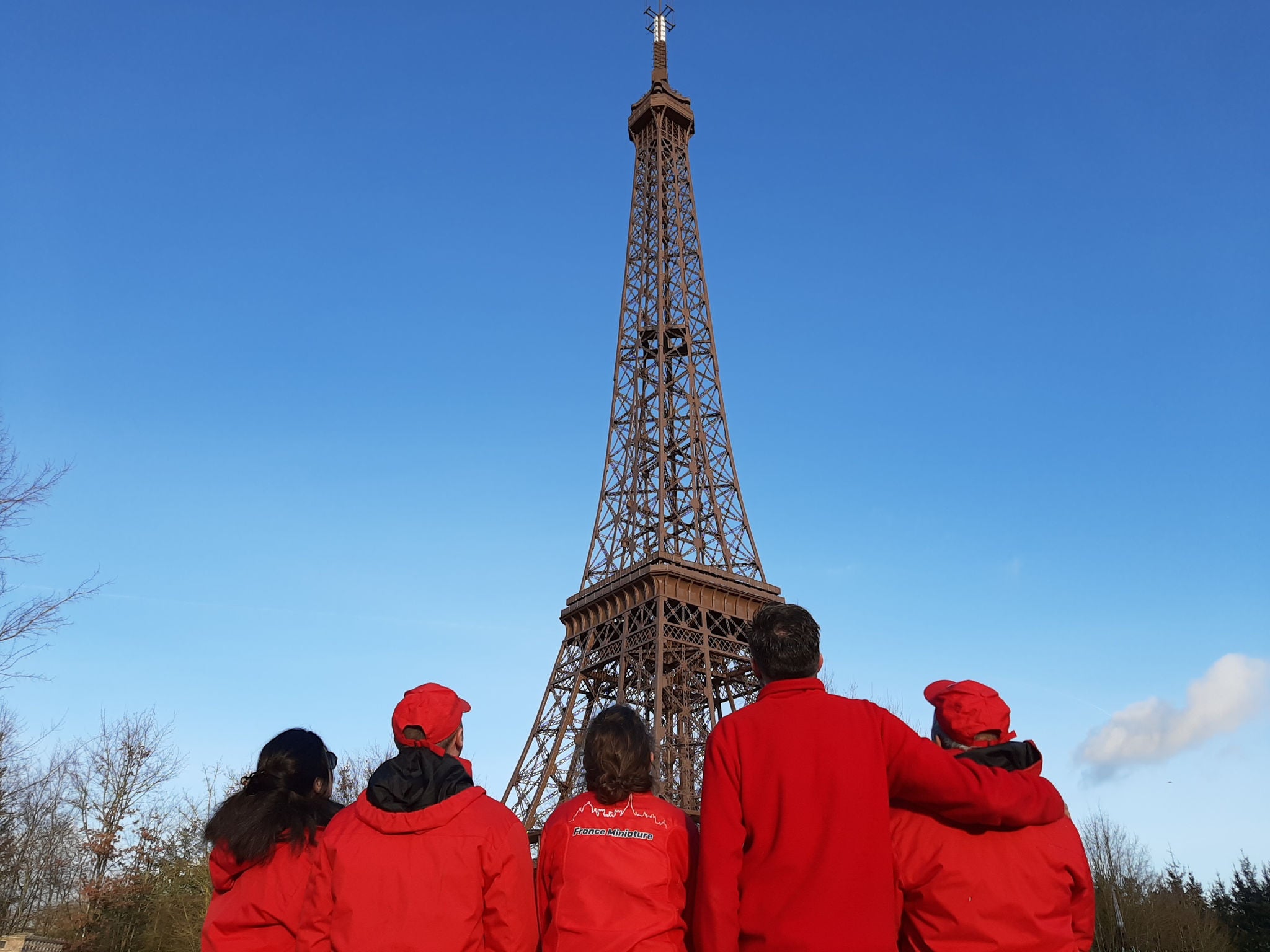 France Miniature team in front of miniature Eiffel tower